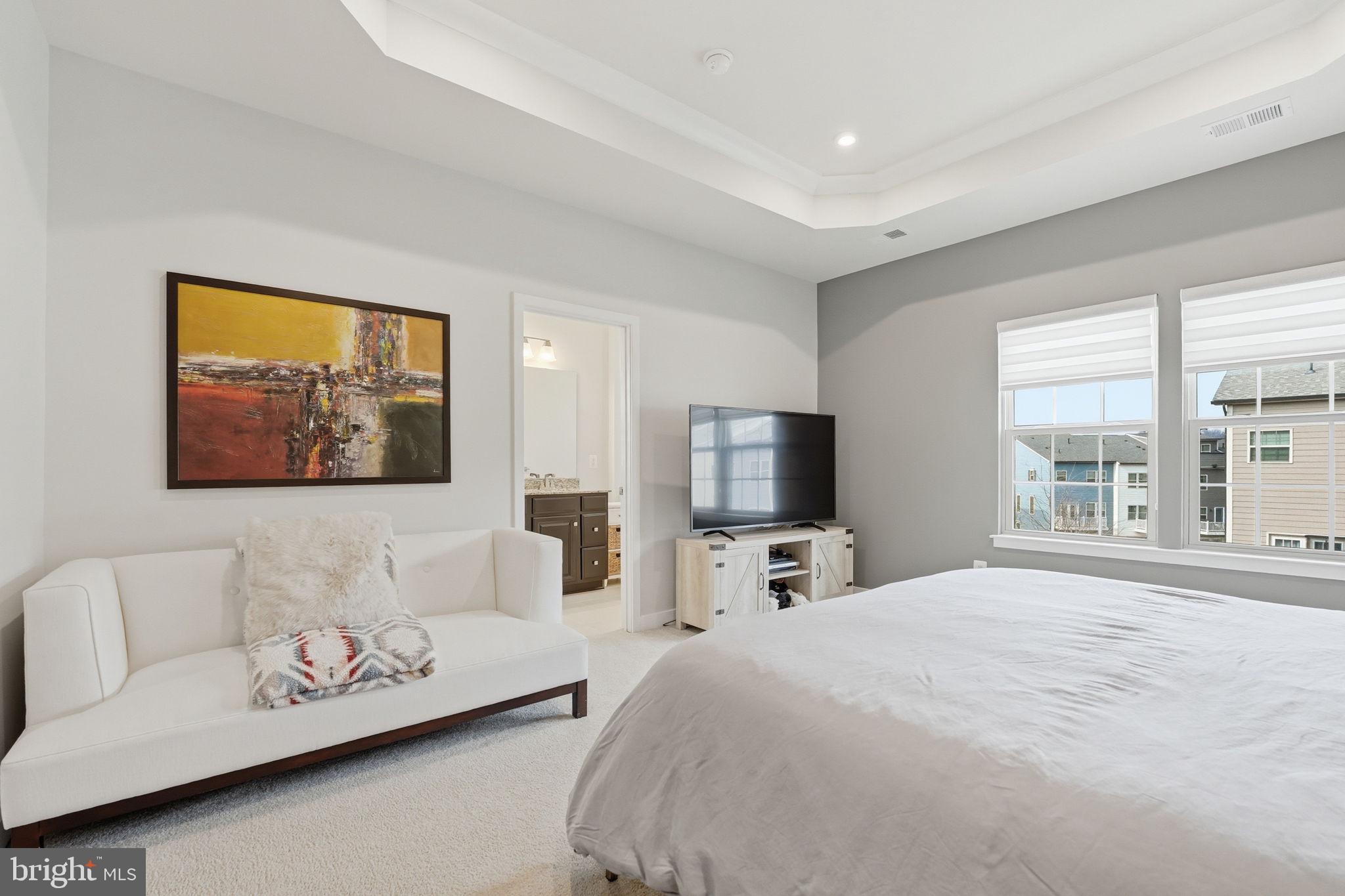 18112 Red Cedar Road Dumfries, VA 22026 - Photo 22 of 69 a bedroom with bed and a flat screen tv