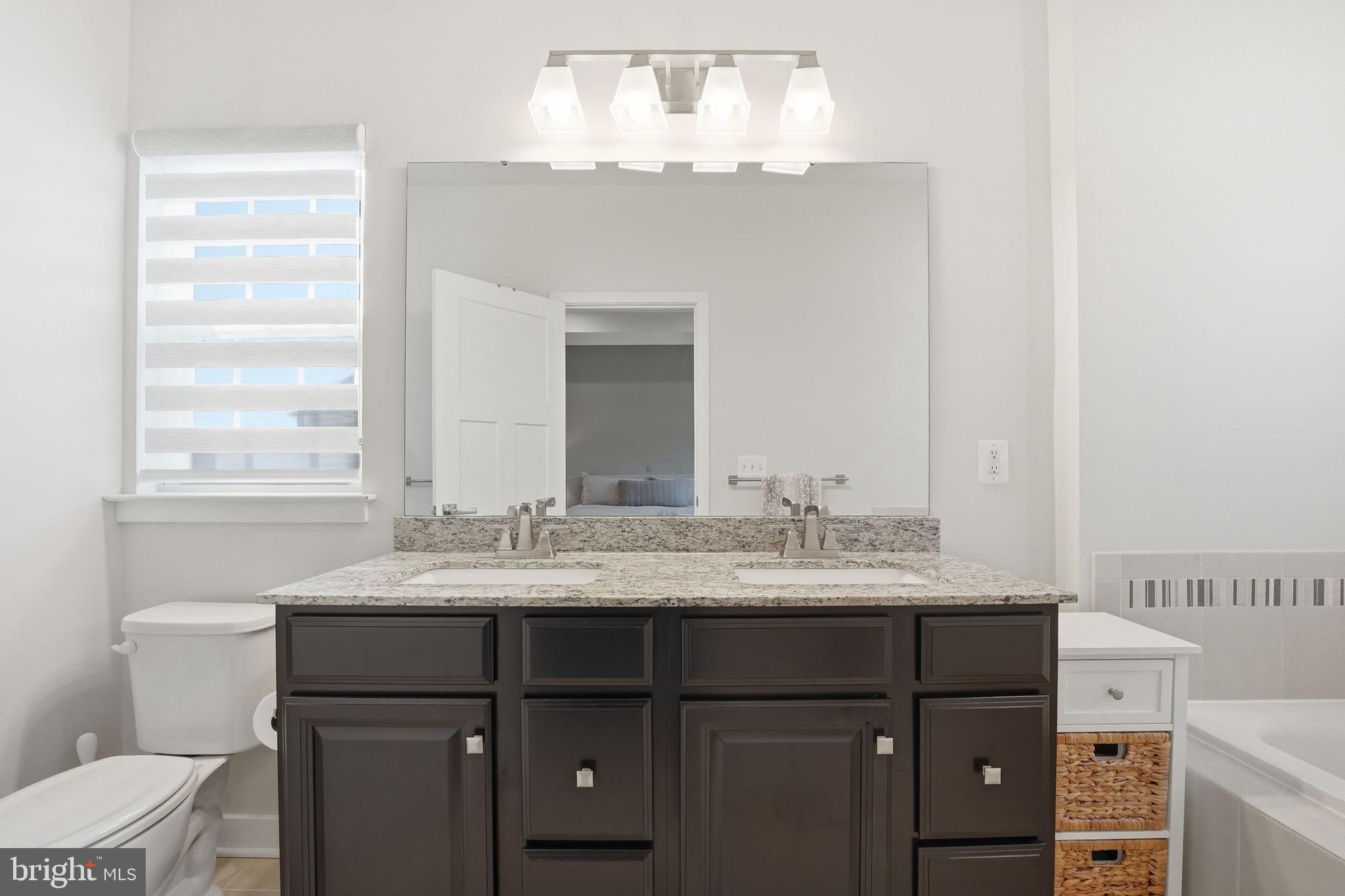 18112 Red Cedar Road Dumfries, VA 22026 - Photo 25 of 69 a bathroom with a sink vanity and a mirror
