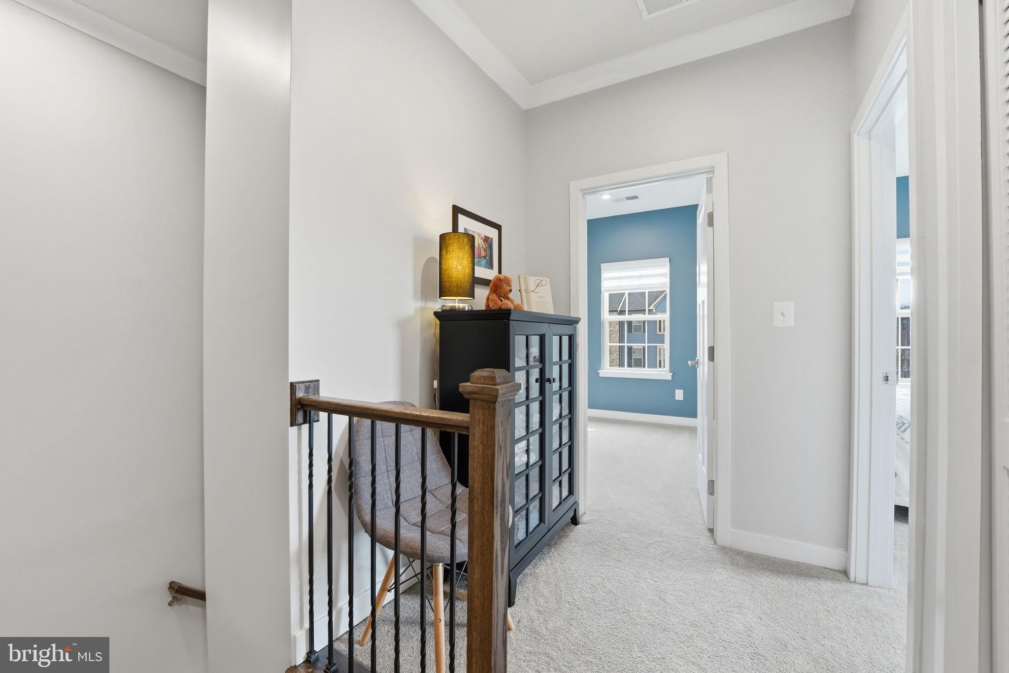 18112 Red Cedar Road Dumfries, VA 22026 - Photo 28 of 69 a view of a hallway with wooden floor and a hallway