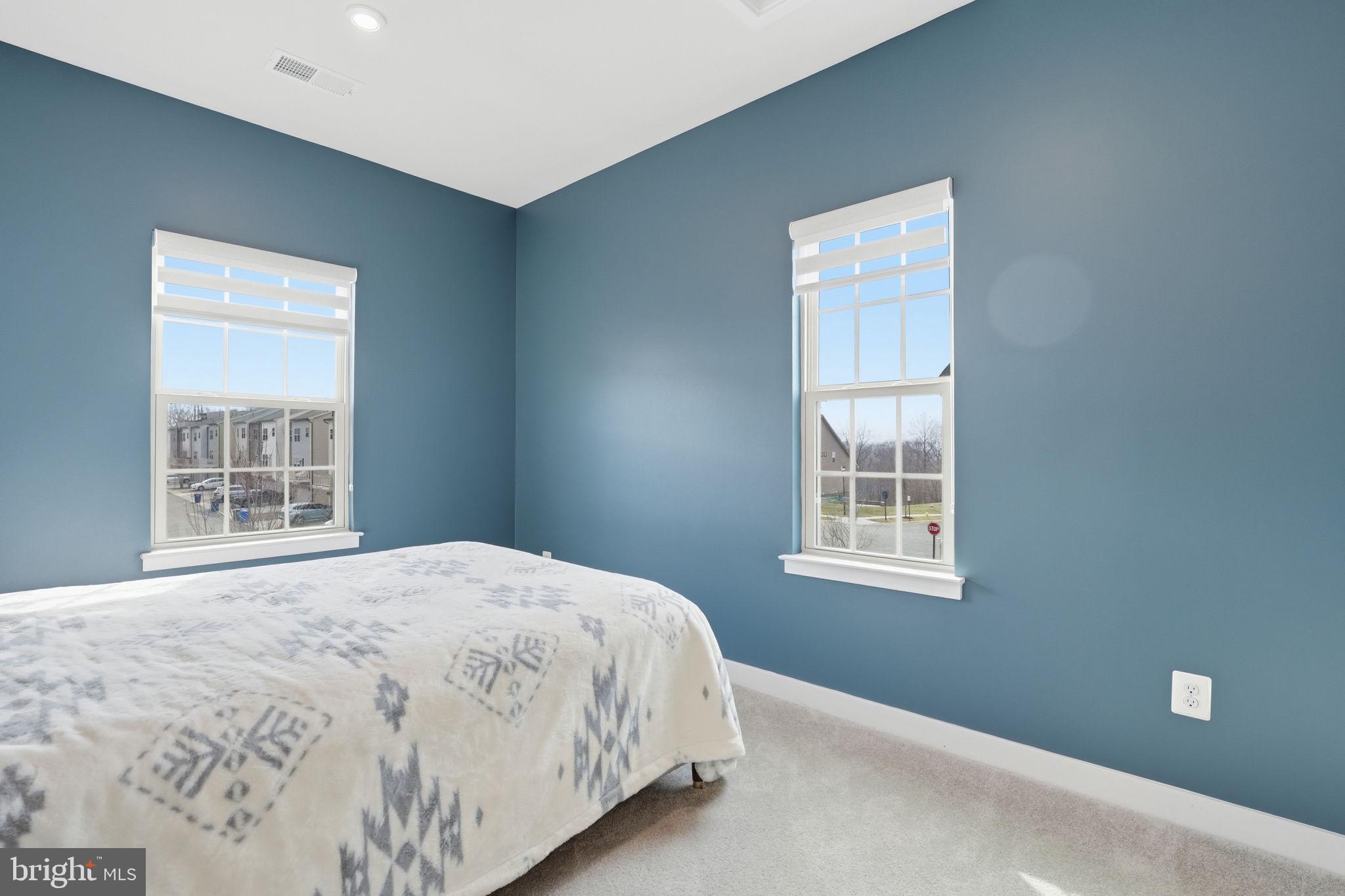 18112 Red Cedar Road Dumfries, VA 22026 - Photo 29 of 69 a bedroom with a bed and a window