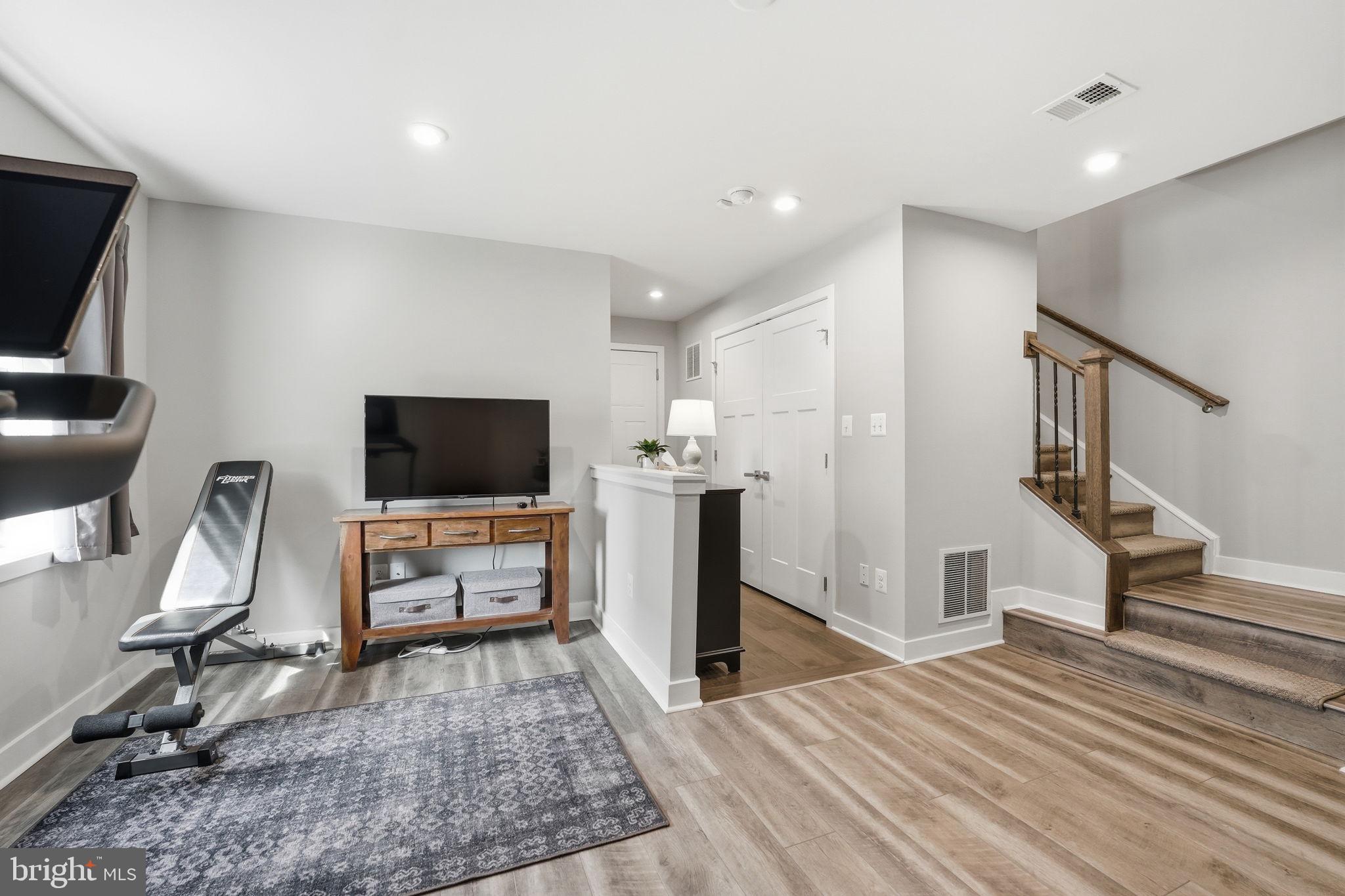 18112 Red Cedar Road Dumfries, VA 22026 - Photo 34 of 69 a bedroom with furniture and a flat screen tv