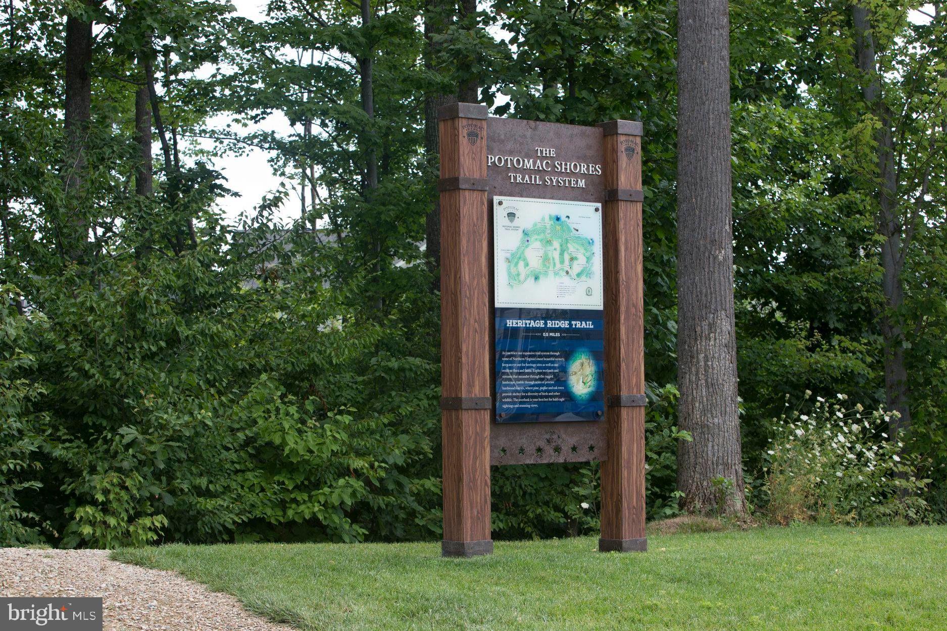 18112 Red Cedar Road Dumfries, VA 22026 - Photo 62 of 69 a sign that is sitting in front of a tree