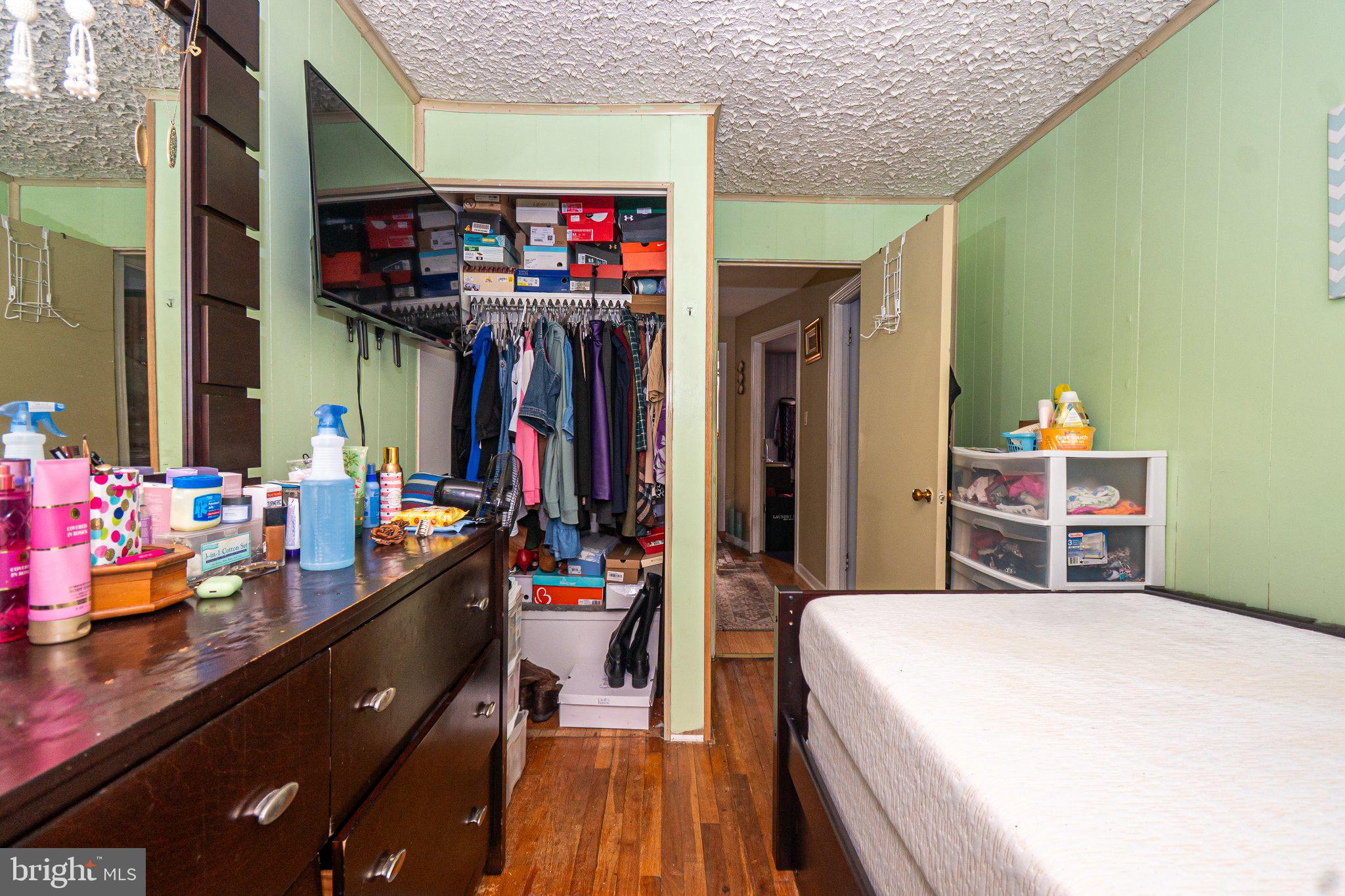 2929 Mallview Road Baltimore, MD 21230 - Photo 12 of 35 Cozy bedroom with organized closet space.