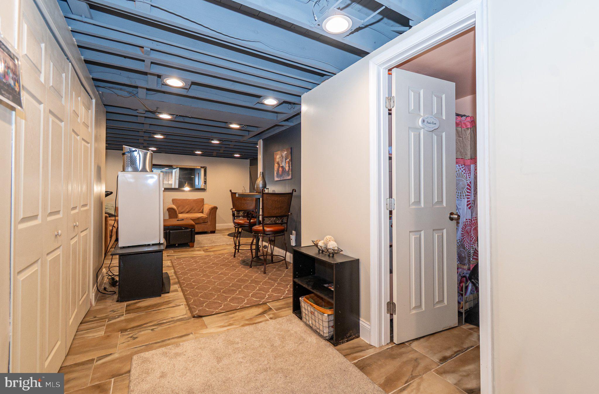 2929 Mallview Road Baltimore, MD 21230 - Photo 22 of 35 Cozy basement retreat with modern flair.