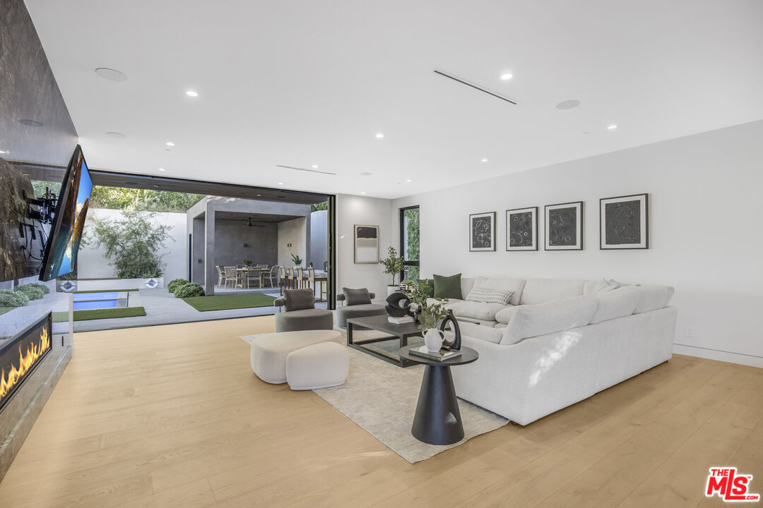 4246 Levitt Lane Sherman Oaks, CA 91403 - Photo 13 of 63 a living room with furniture and a flat screen tv