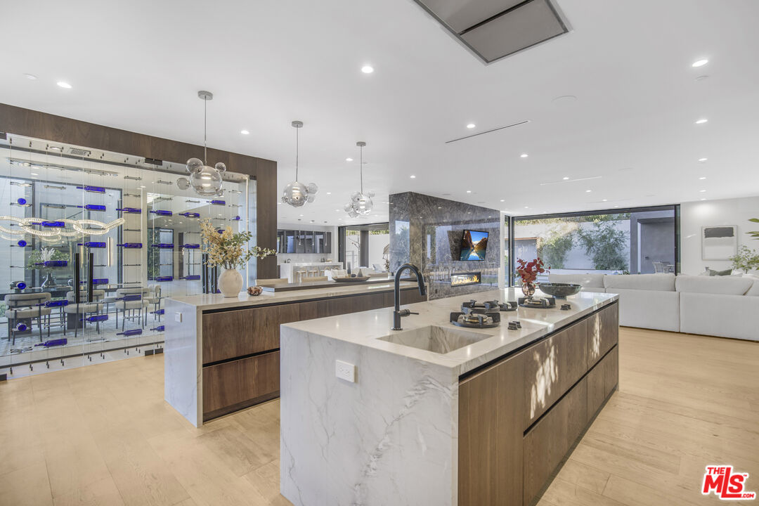 4246 Levitt Lane Sherman Oaks, CA 91403 - Photo 14 of 63 a kitchen with stainless steel appliances granite countertop a sink and a stove