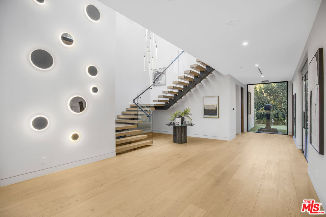 4246 Levitt Lane Sherman Oaks, CA 91403 - Photo 22 of 63 a view of a livingroom with wooden floor and windows