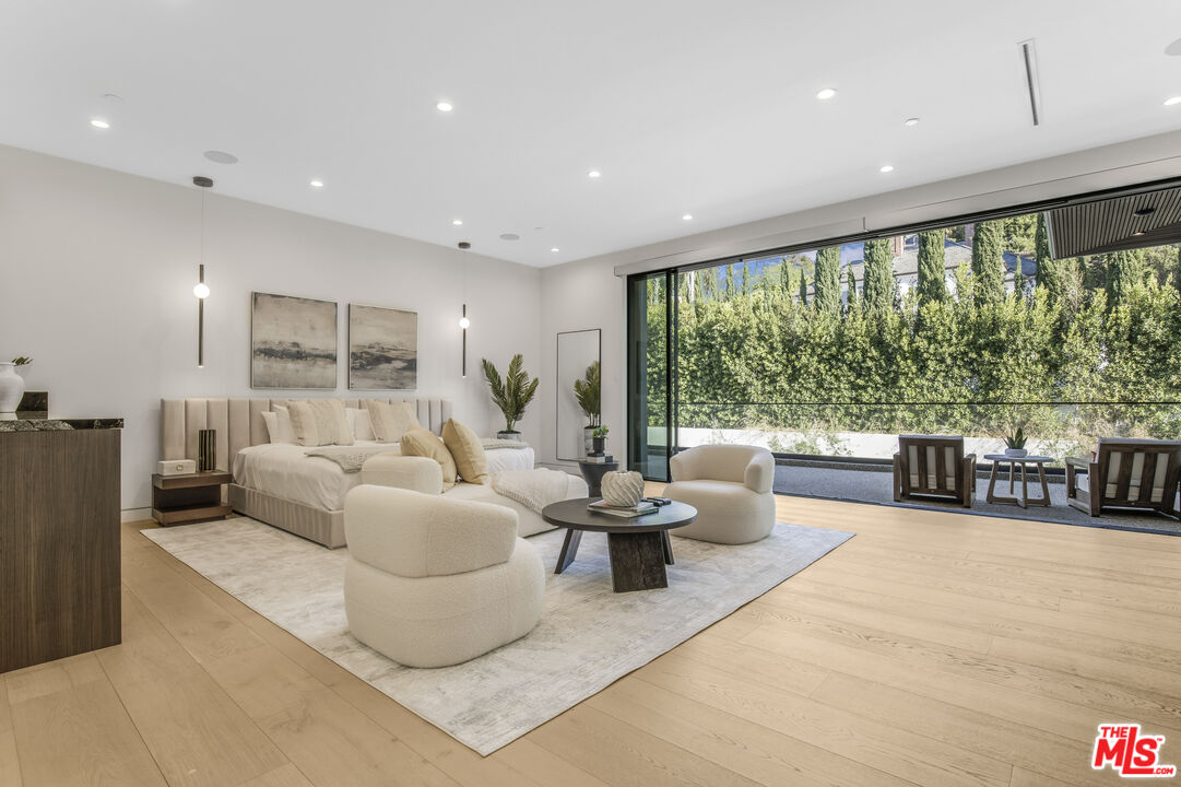 4246 Levitt Lane Sherman Oaks, CA 91403 - Photo 28 of 63 a living room with furniture and a large window