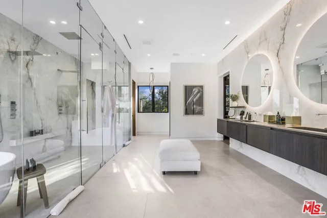 a spacious bedroom with a large bed and a couch