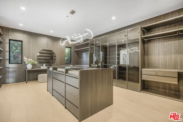 a bedroom with a bed and a night stand