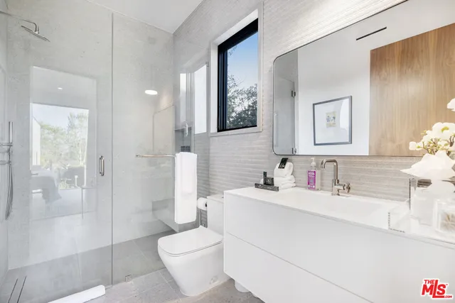 a utility room with sink dryer and washer