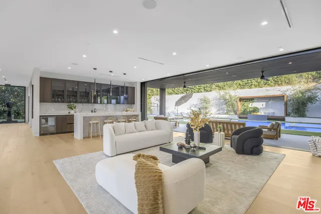 a dining room with fireplace furniture and a large window
