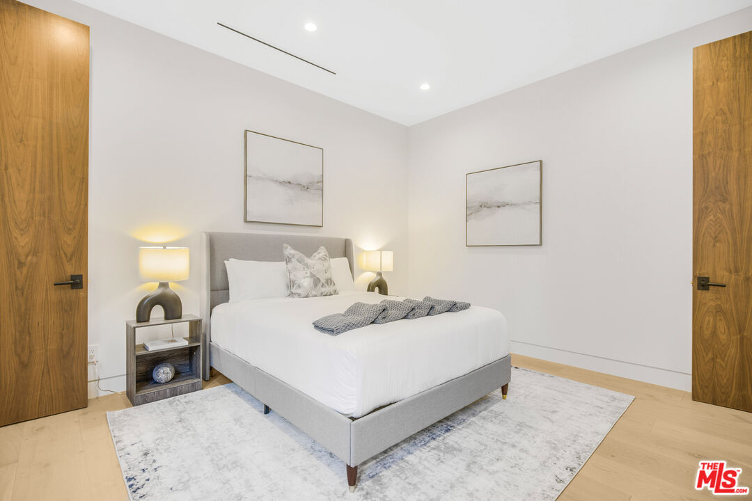 4246 Levitt Lane Sherman Oaks, CA 91403 - Photo 43 of 63 a bedroom with a bed and a night stand