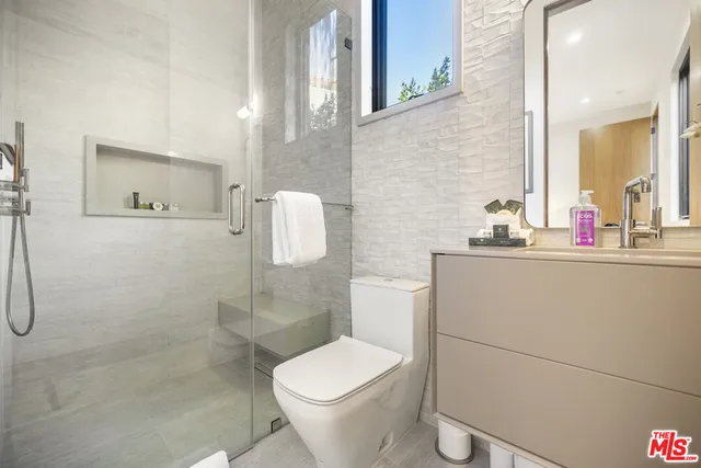 a view of a house with pool and sitting area