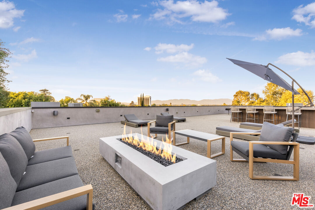 4246 Levitt Lane Sherman Oaks, CA 91403 - Photo 49 of 63 a view of a roof deck with couches and potted plants