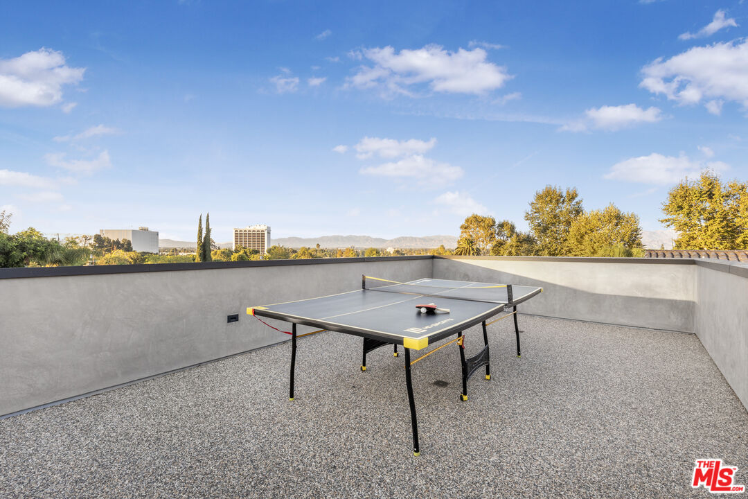 4246 Levitt Lane Sherman Oaks, CA 91403 - Photo 51 of 63 a terrace with a table and chairs