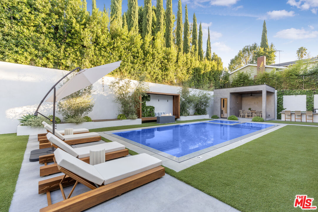 4246 Levitt Lane Sherman Oaks, CA 91403 - Photo 53 of 63 a view of house with swimming pool outdoor seating