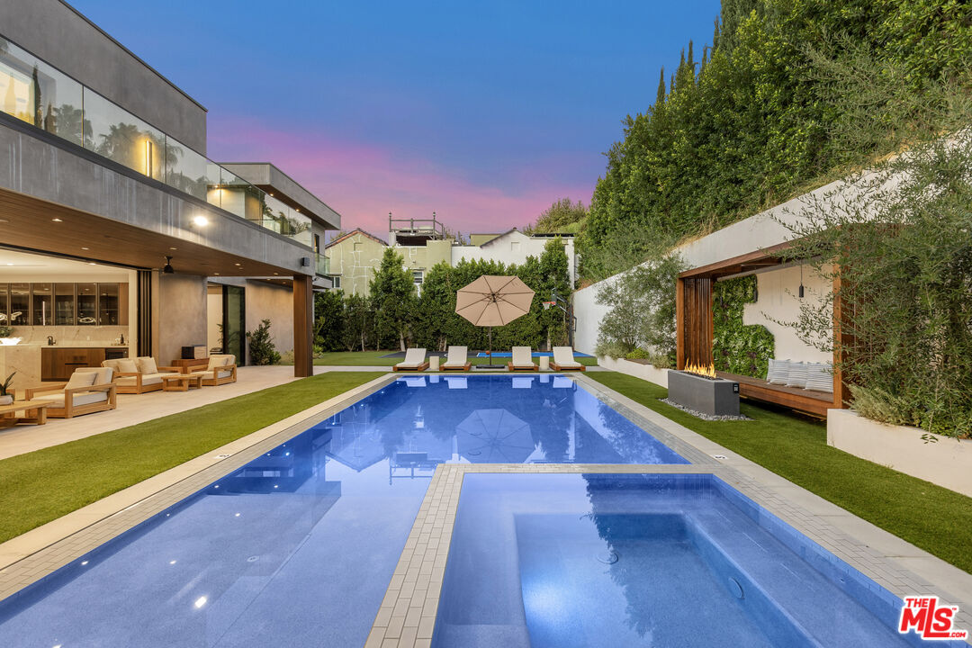4246 Levitt Lane Sherman Oaks, CA 91403 - Photo 54 of 63 a view of a house with swimming pool and sitting area