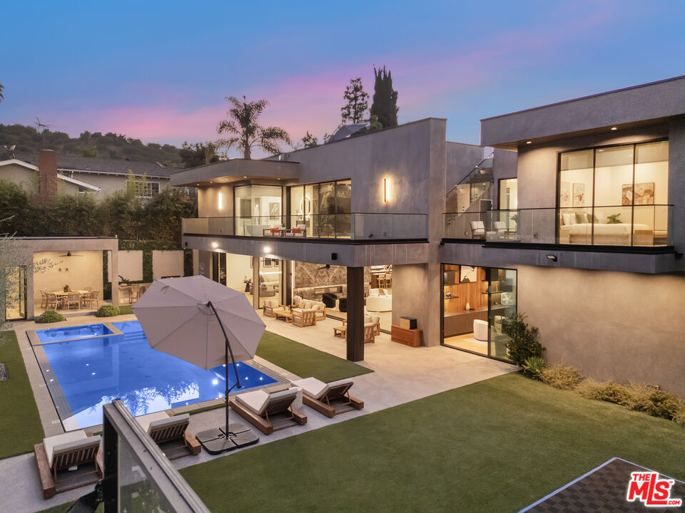 4246 Levitt Lane Sherman Oaks, CA 91403 - Photo 59 of 63 a dining room with furniture and a floor to ceiling window