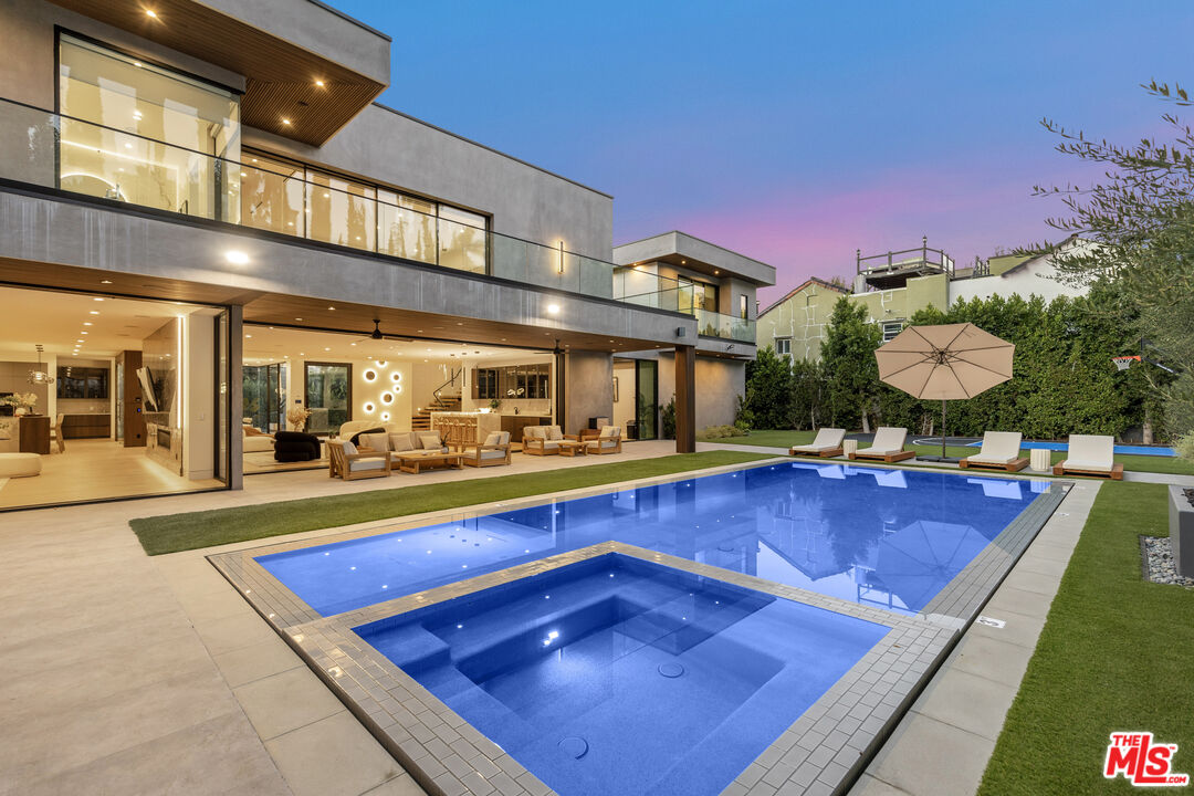 4246 Levitt Lane Sherman Oaks, CA 91403 - Photo 7 of 63 a swimming pool with outdoor seating
