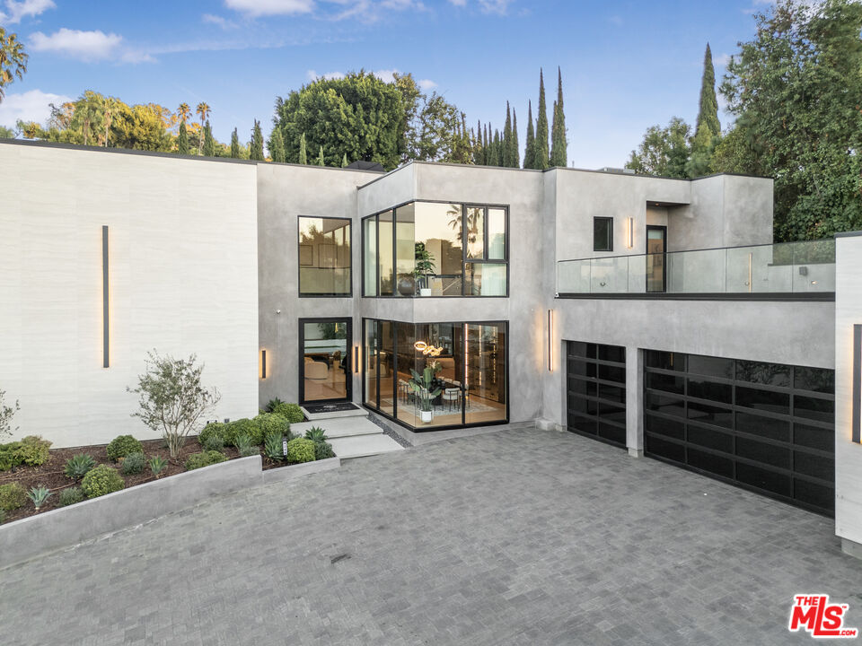 4246 Levitt Lane Sherman Oaks, CA 91403 - Photo 9 of 63 a view of a house with a balcony and yard