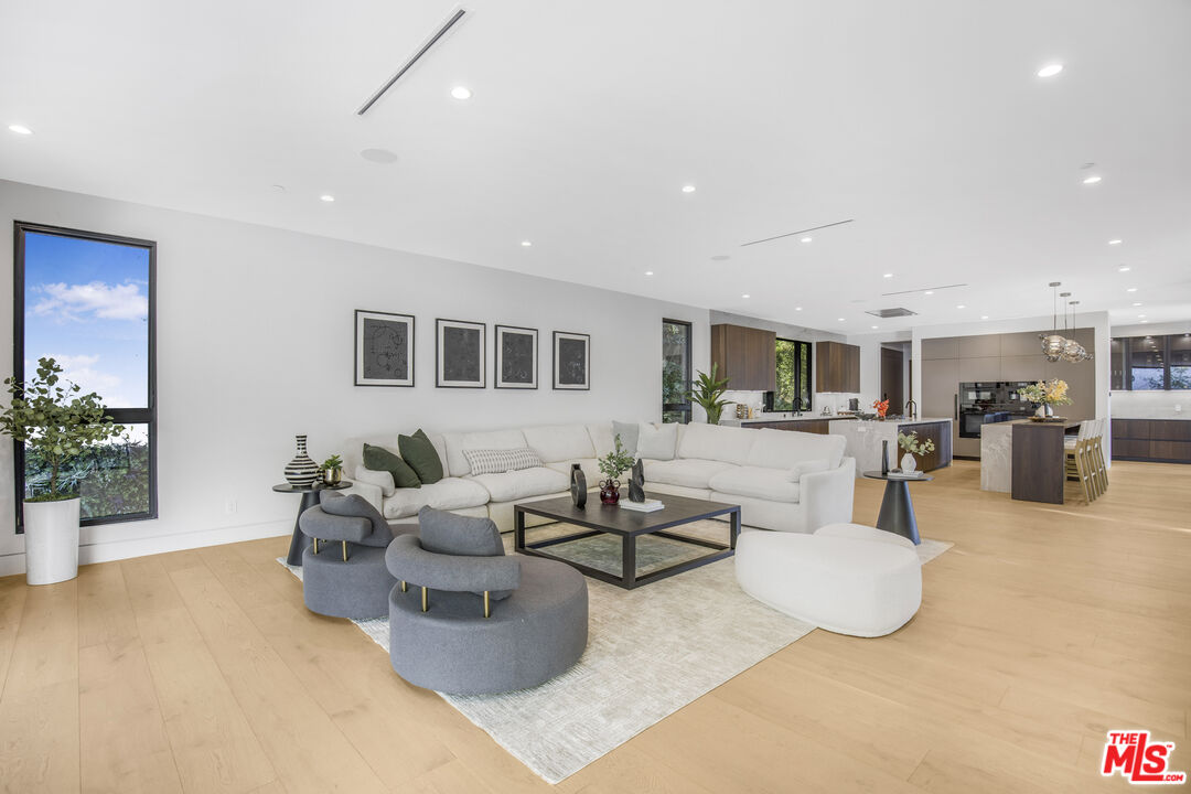 4246 Levitt Lane Sherman Oaks, CA 91403 - Photo 10 of 63 a living room with furniture and a potted plant