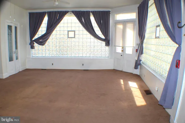 an empty room with windows