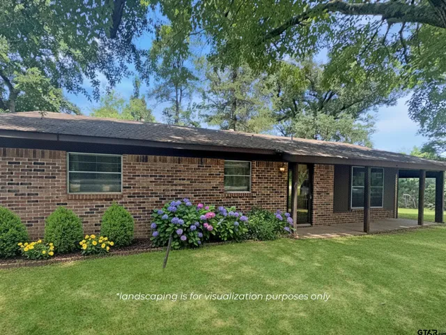a view of a house with a garden