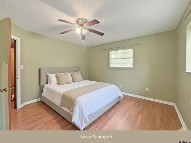 a bedroom with a bed and window
