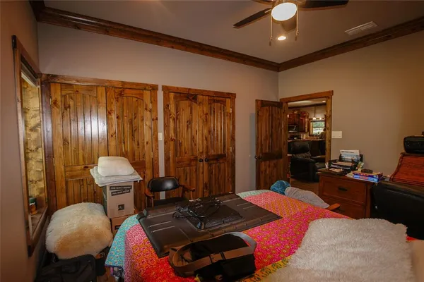 a room with furniture and wooden walls