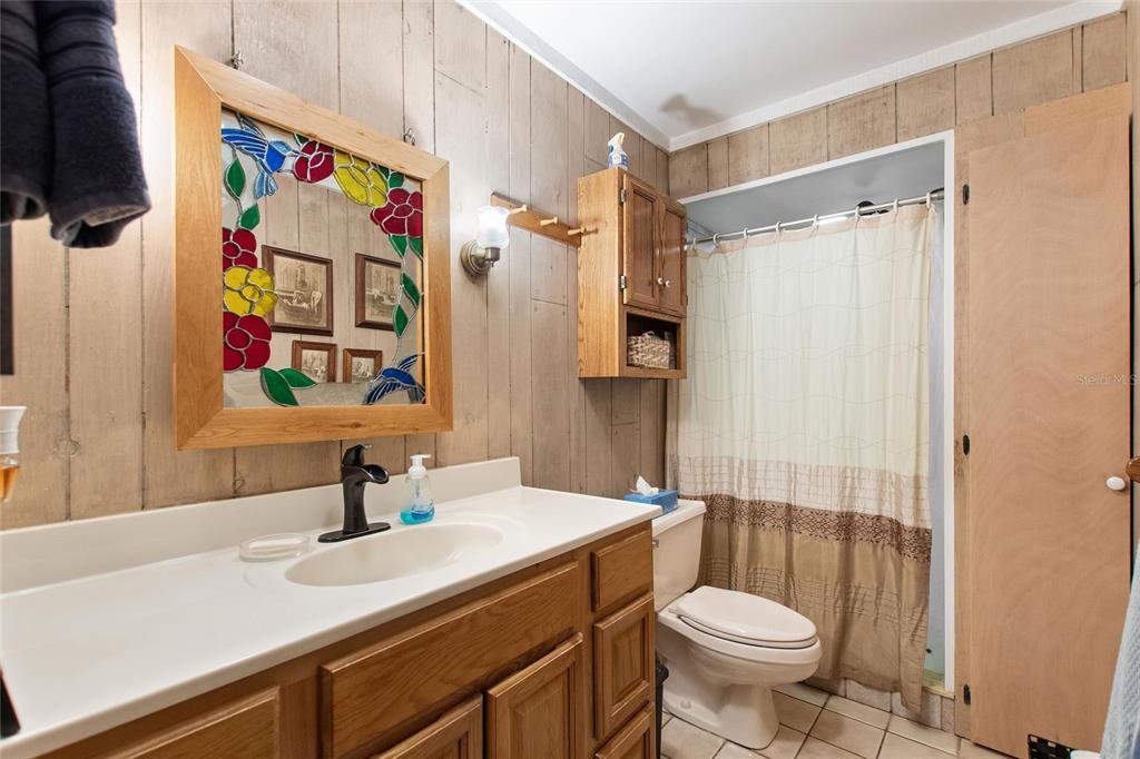 3641 Turtle Mound Road Melbourne, FL 32934 - Photo 30 of 77 a bathroom with a sink toilet and shower