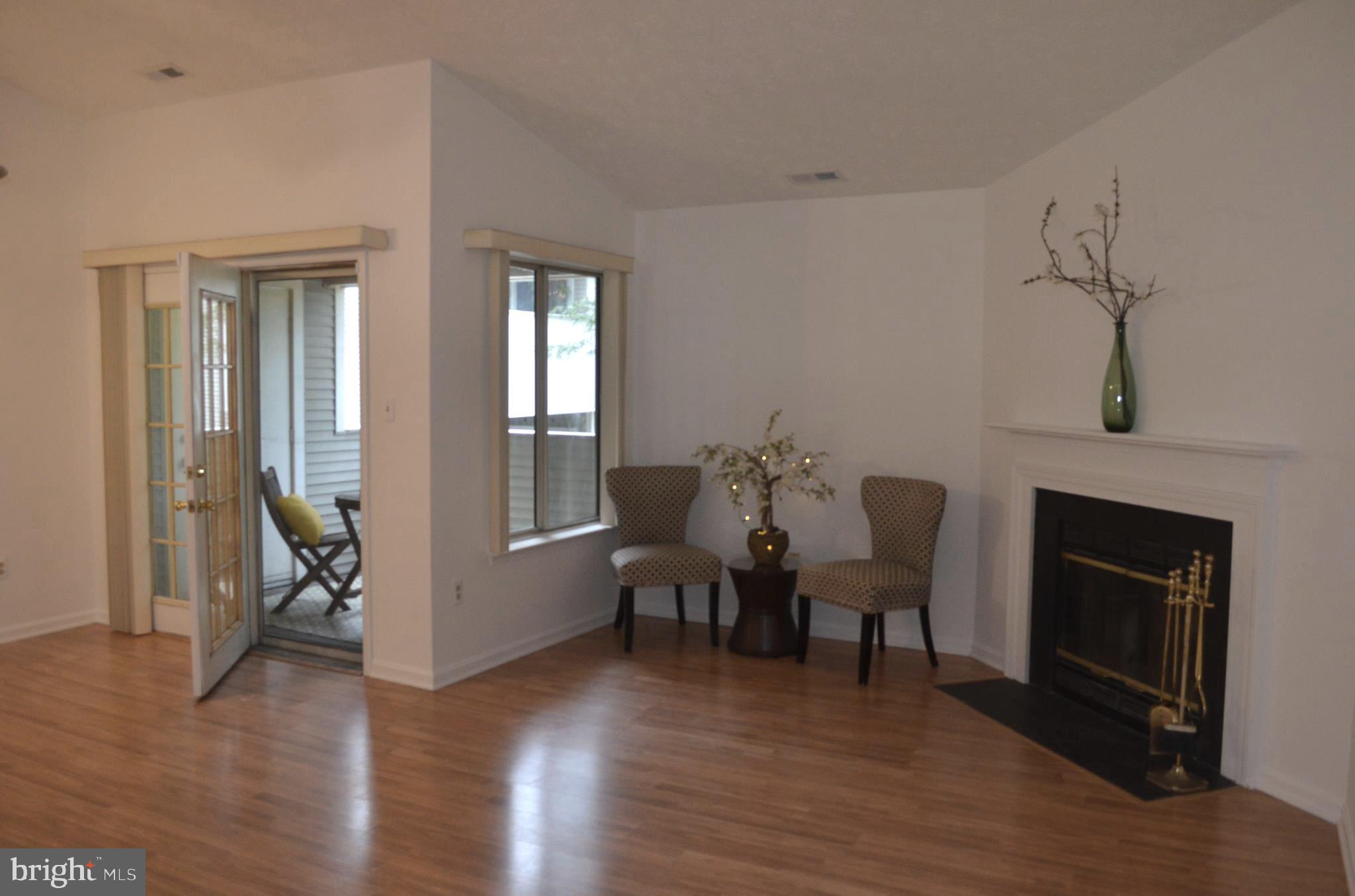 a view of a livingroom with furniture and a fireplace