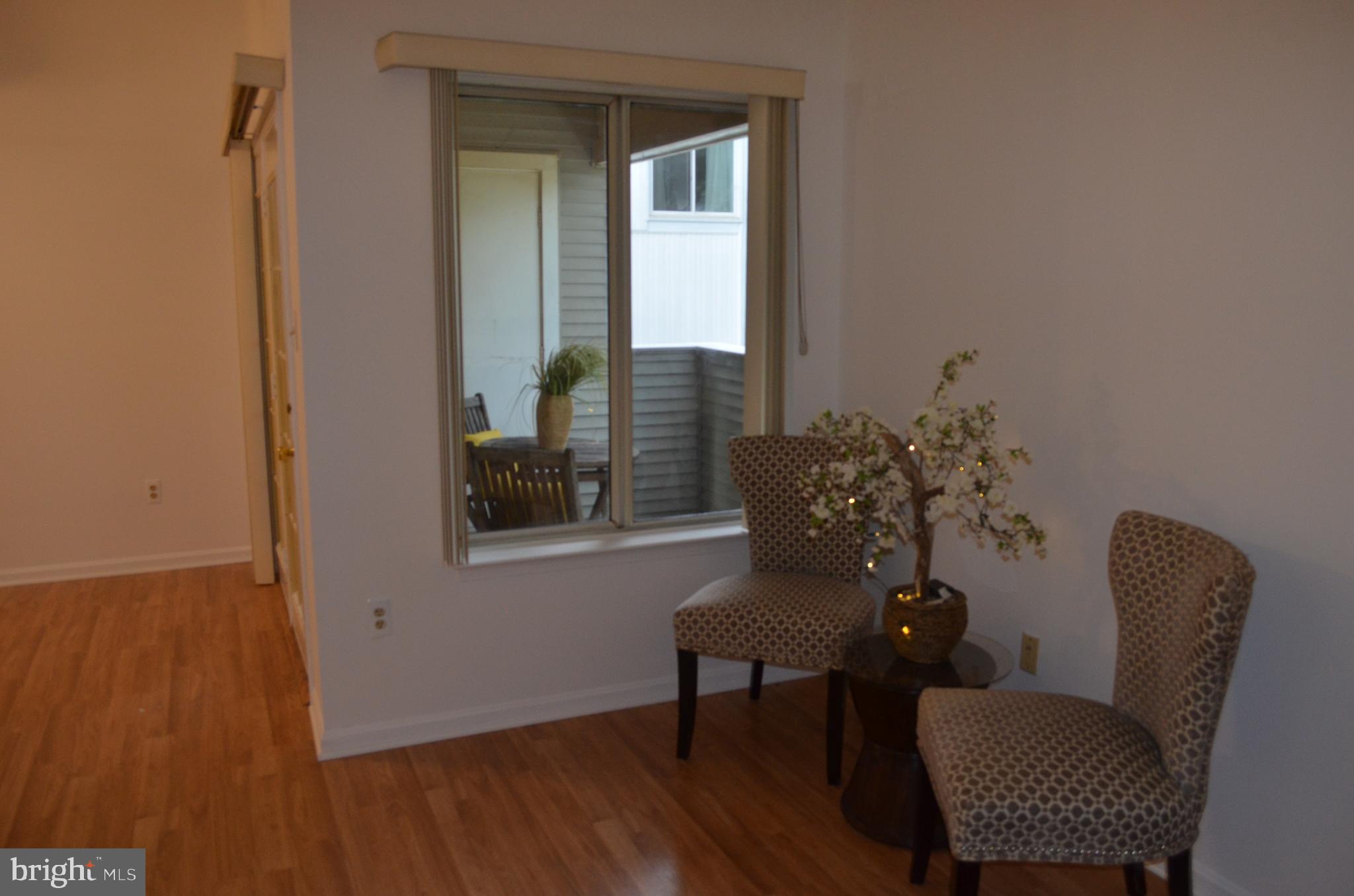 2137 Wainwright Court, Unit 2D Frederick, MD 21702 - Photo 11 of 31 a view of a livingroom with furniture and a window