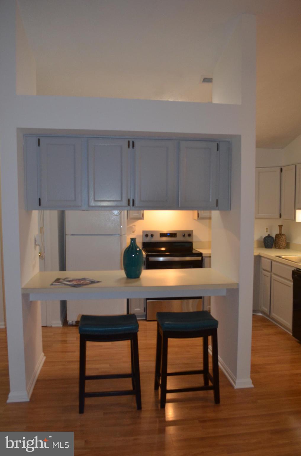 2137 Wainwright Court, Unit 2D Frederick, MD 21702 - Photo 14 of 31 a kitchen with a table and chairs