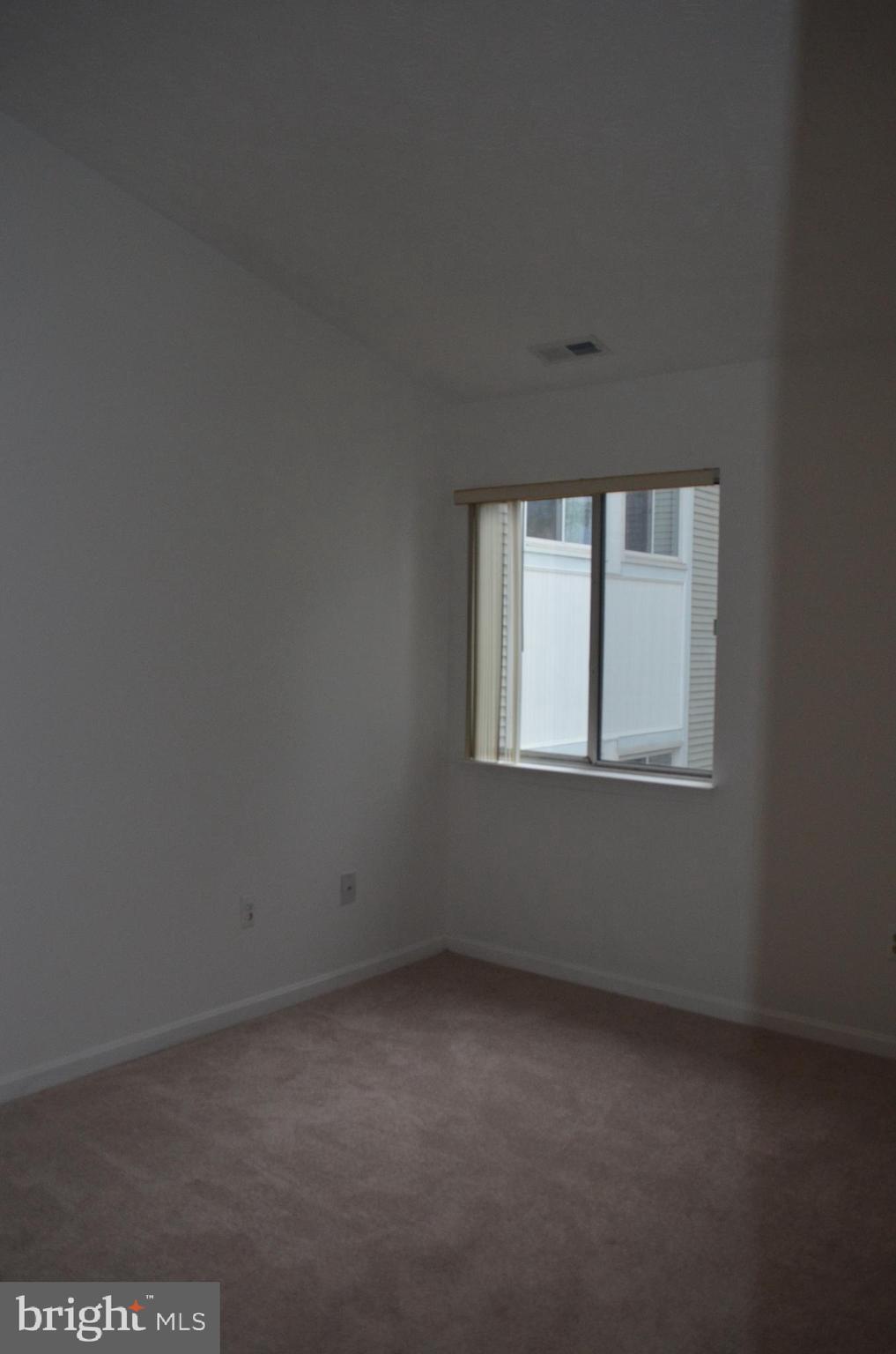 2137 Wainwright Court, Unit 2D Frederick, MD 21702 - Photo 16 of 31 a view of an empty room with a window
