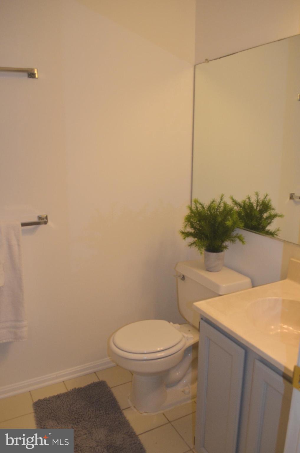 2137 Wainwright Court, Unit 2D Frederick, MD 21702 - Photo 18 of 31 a white toilet sitting next to a shower