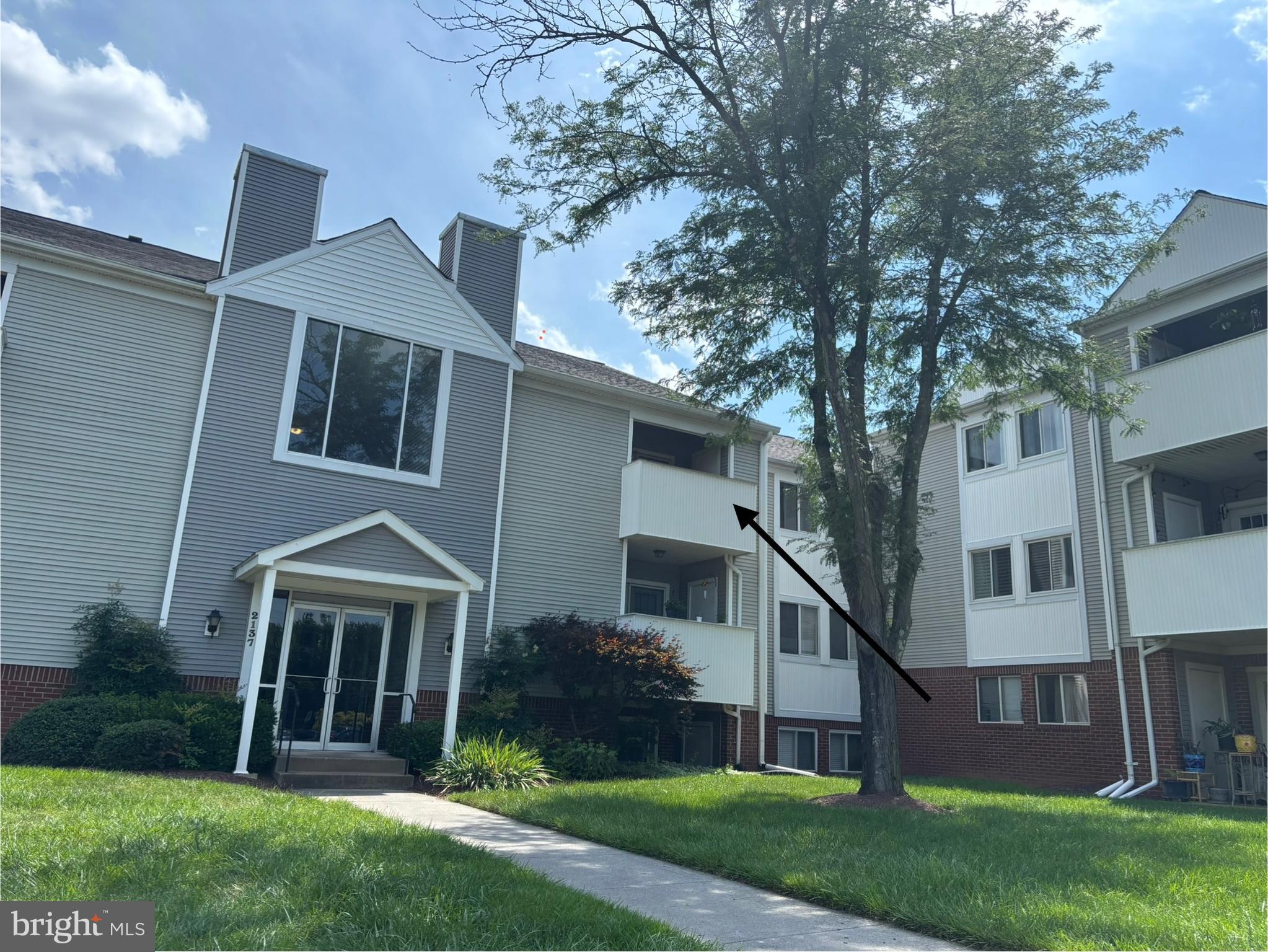 2137 Wainwright Court, Unit 2D Frederick, MD 21702 - Photo 2 of 31 a view of a house with a yard and large tree