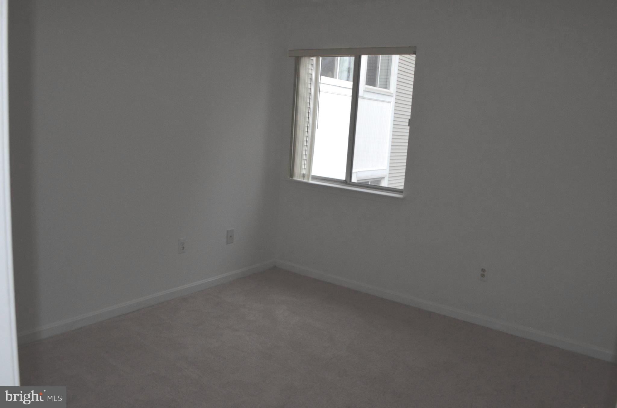 2137 Wainwright Court, Unit 2D Frederick, MD 21702 - Photo 22 of 31 an empty room with a window