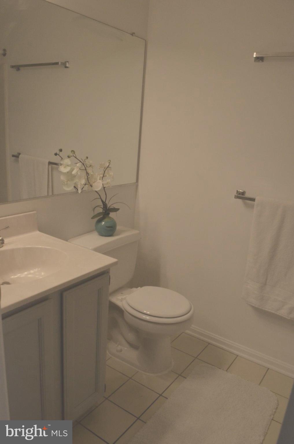 2137 Wainwright Court, Unit 2D Frederick, MD 21702 - Photo 24 of 31 a bathroom with a sink a toilet and vanity