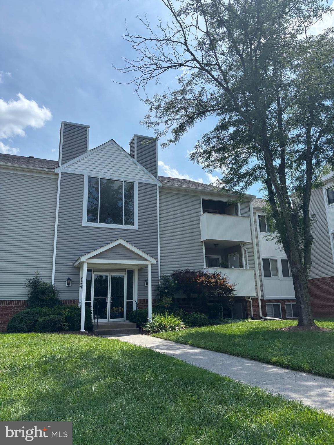 2137 Wainwright Court, Unit 2D Frederick, MD 21702 - Photo 3 of 31 a front view of a house with a garden