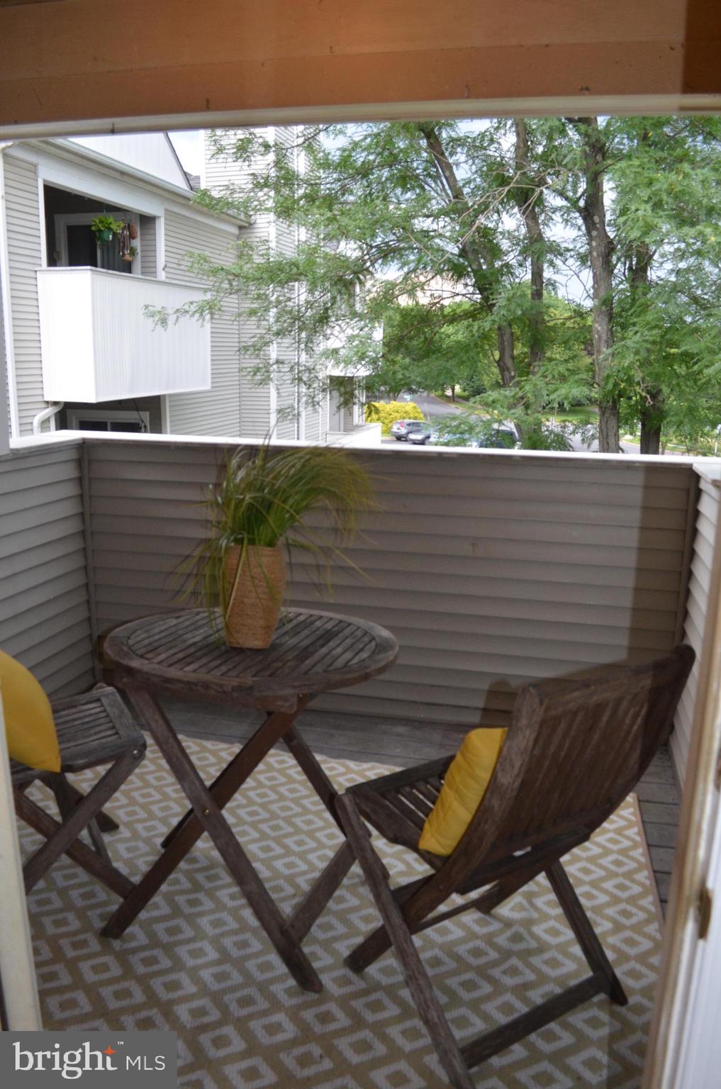 2137 Wainwright Court, Unit 2D Frederick, MD 21702 - Photo 7 of 31 a view of a chairs and table on the terrace