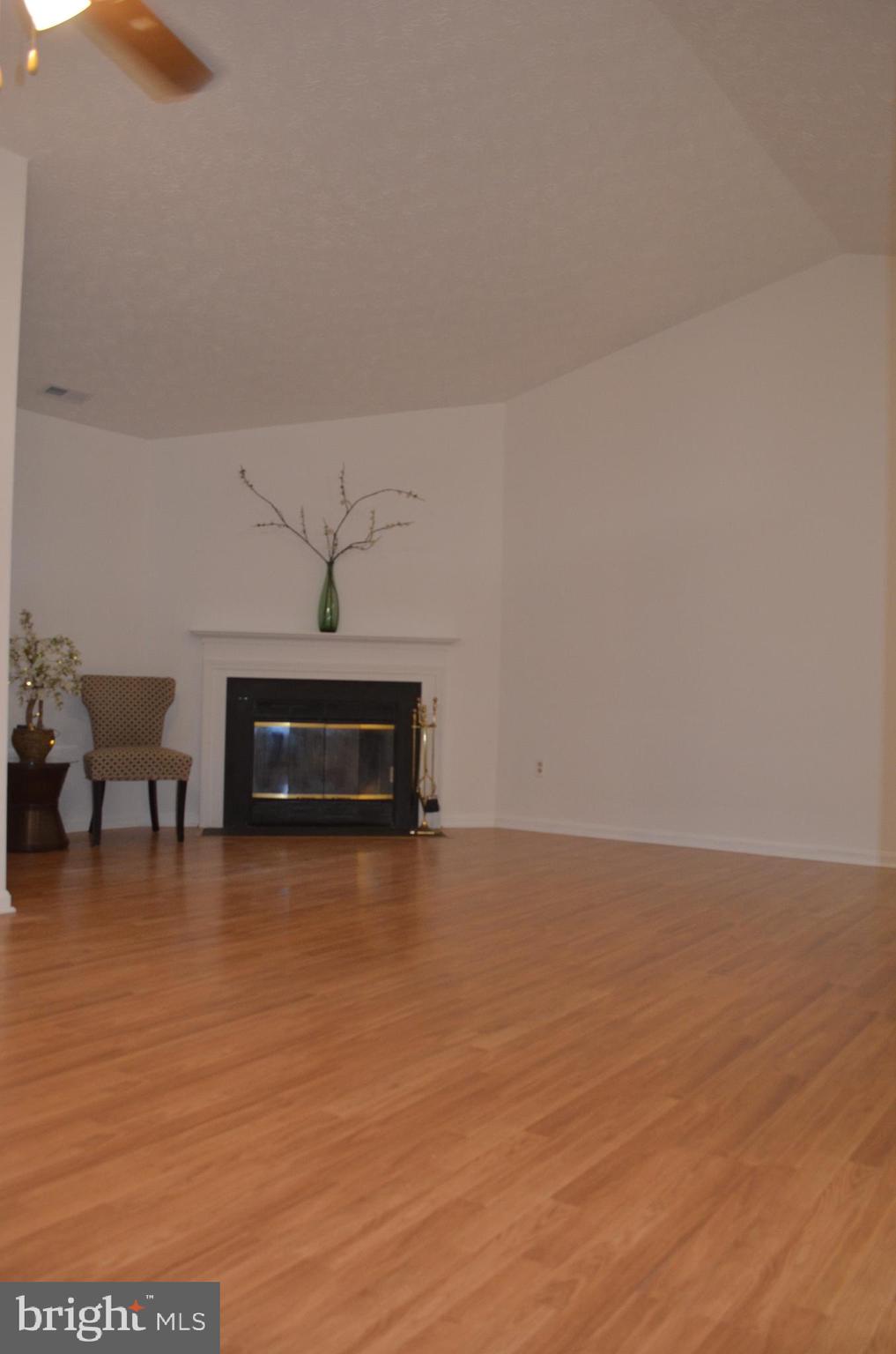 2137 Wainwright Court, Unit 2D Frederick, MD 21702 - Photo 10 of 31 a living room with furniture and a fireplace