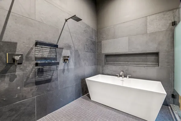 a white bath tub sitting in a bathroom