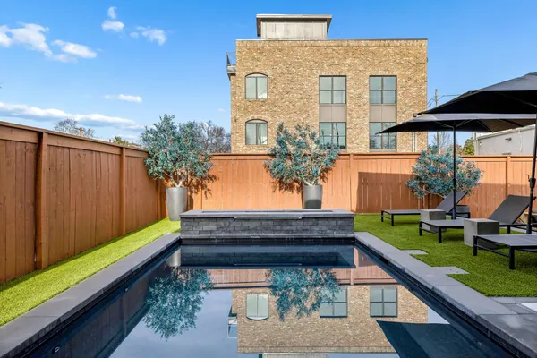 a view of a backyard with sitting area