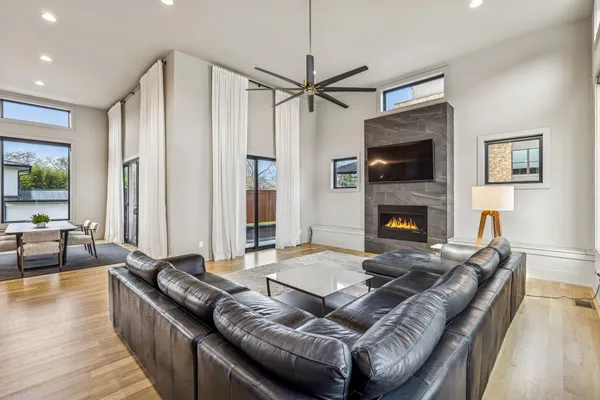 a living room with furniture and a fireplace