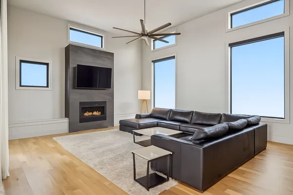 a living room with furniture and a fireplace