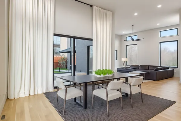 a view of a dining room with furniture and window