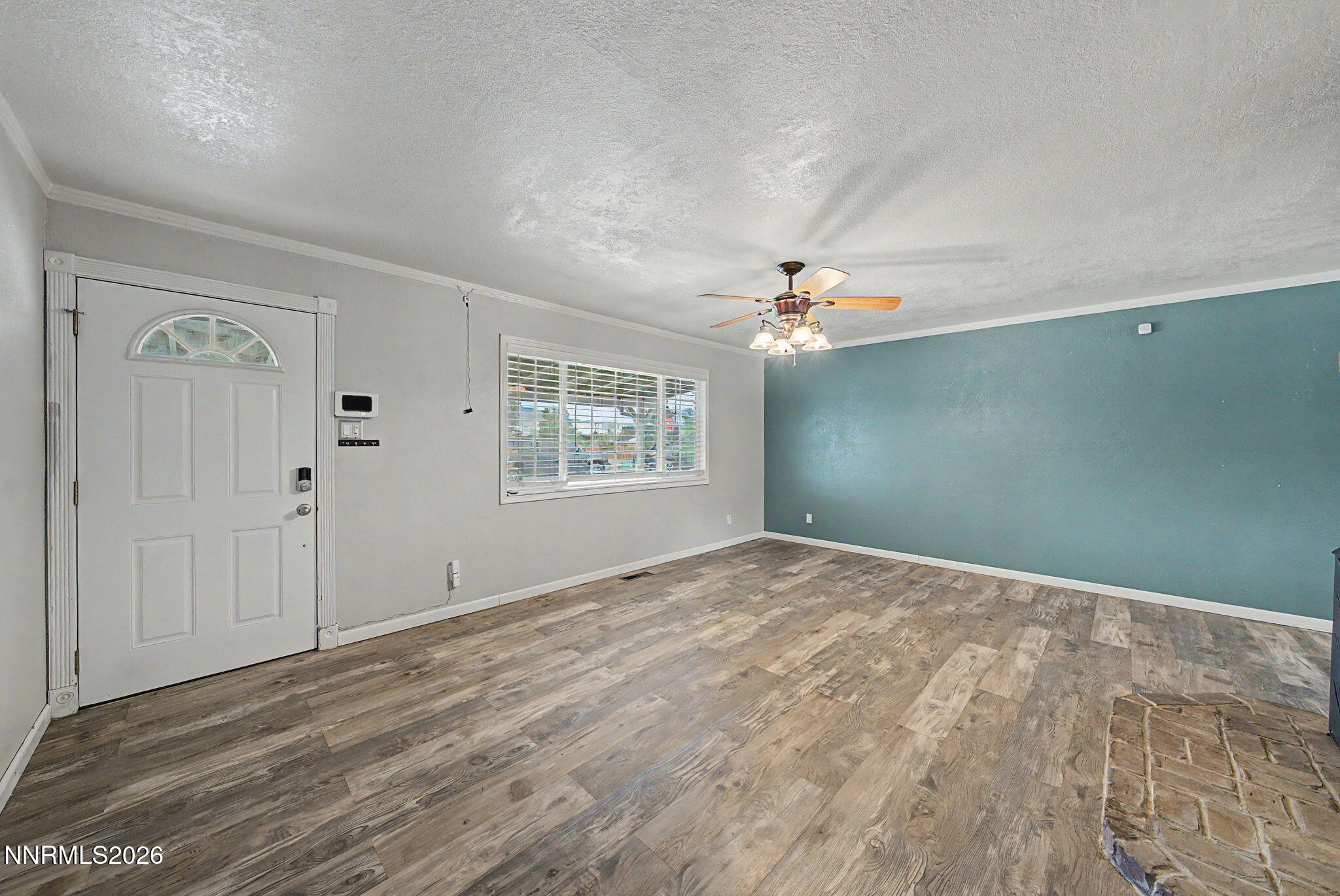 11577 Deodar Way Reno, NV 89506 - Photo 10 of 58 a view of a livingroom with an empty space and a window