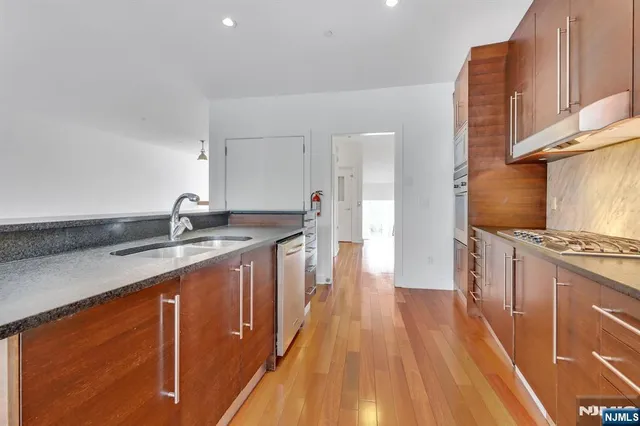 a bathroom with a toilet sink and a mirror