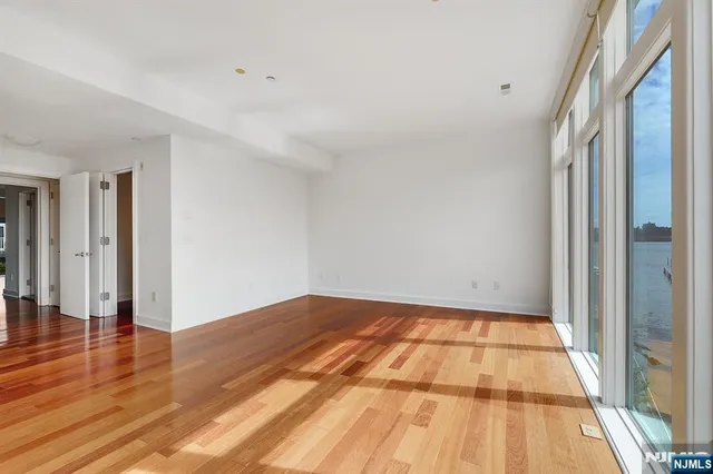 a view of room with wooden floor